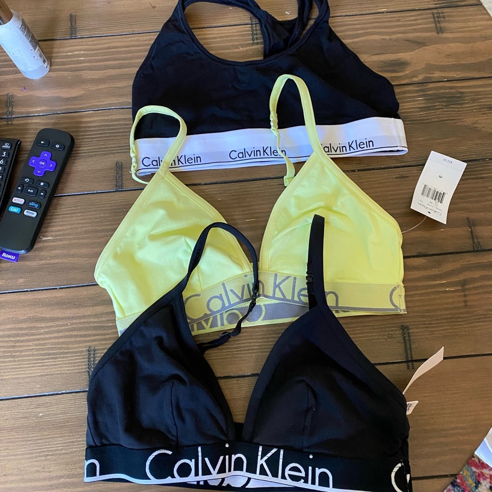3 Calvin Klein bras for sale. Original tags on yellow